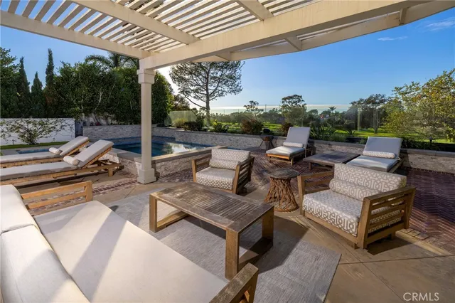 a view of a patio with a table and chairs