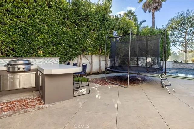 a view of a garden with an ocean