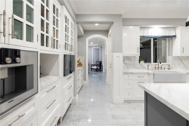 a kitchen with sink and view living room
