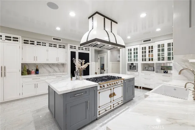 a dining room with furniture a chandelier and wooden floor