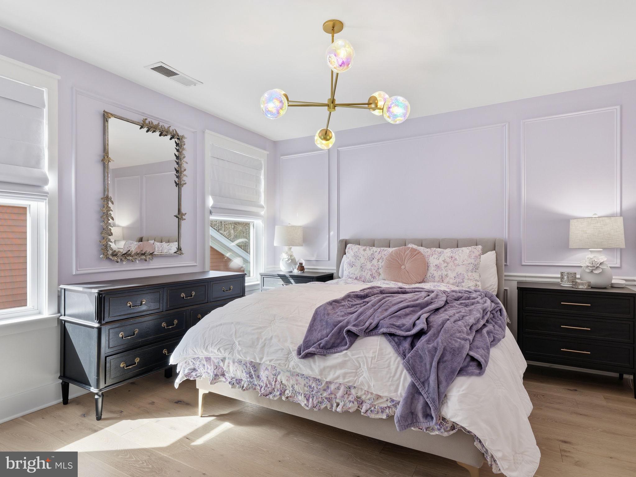 17210 Perinchief Street Ruther Glen, VA 22546 - Photo 23 of 39 a bedroom with a bed and wooden floor
