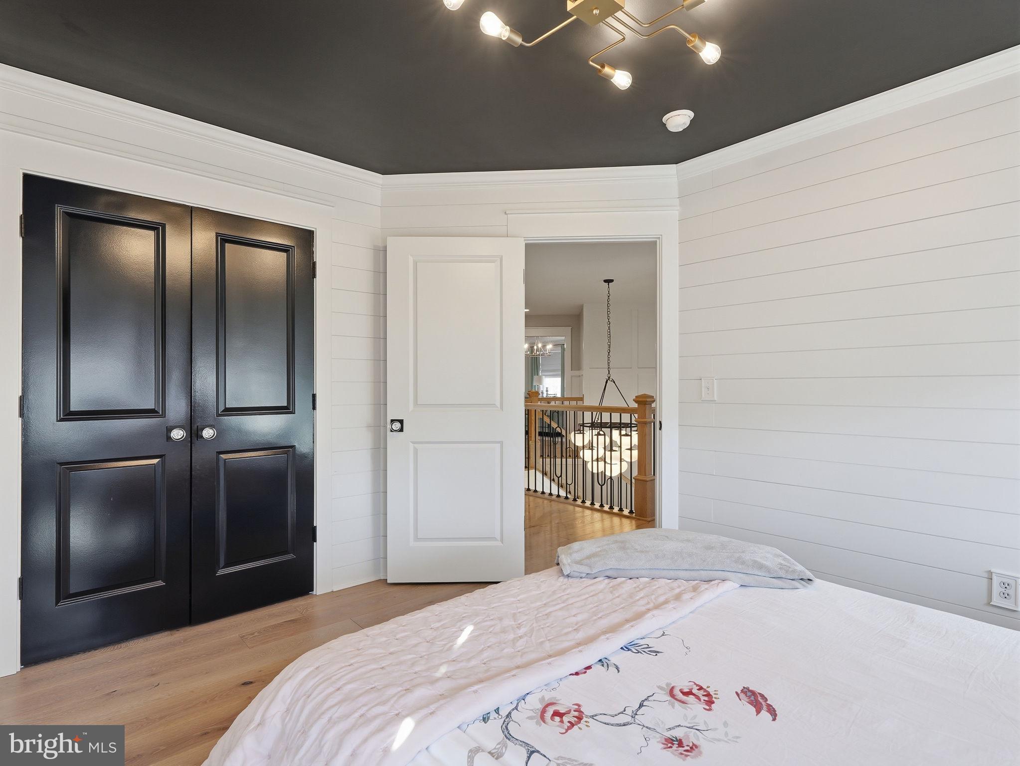 17210 Perinchief Street Ruther Glen, VA 22546 - Photo 27 of 39 a bedroom with a bed and a lamp on dresser