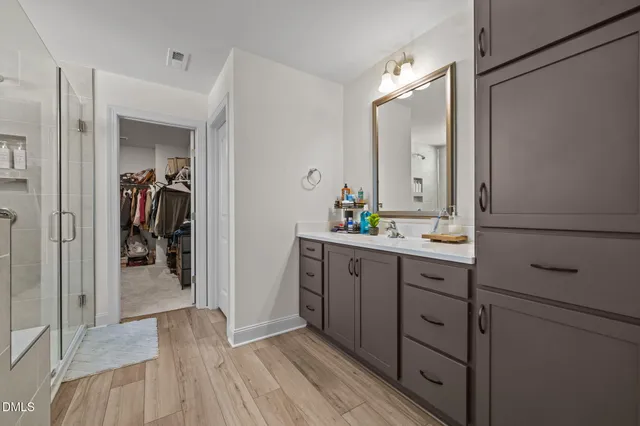 a bathroom with a sink and mirror