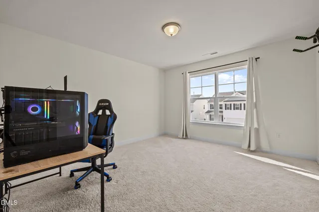 a view of a livingroom with furniture