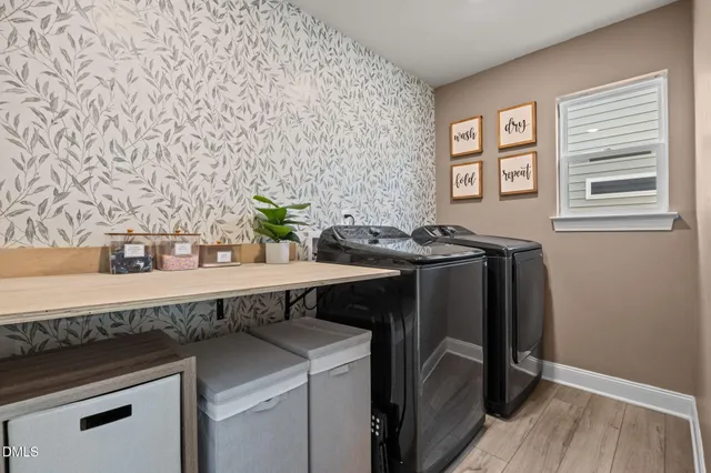 a view of a kitchen with a sink and cabinets