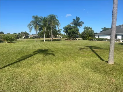 a view of a garden and basketball court