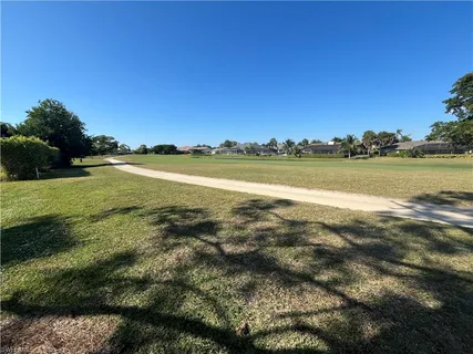 a view of a golf course with a garden