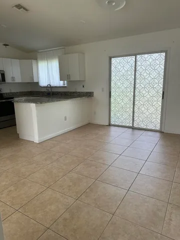 a view of a kitchen with a sink