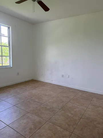 an empty room with a empty space and window