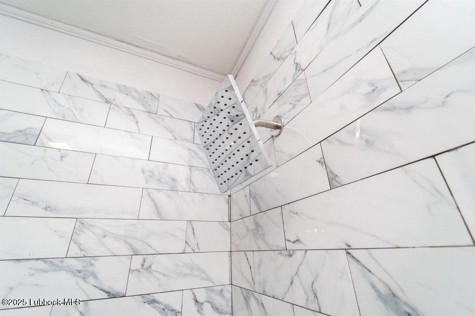 2503 30th Street Lubbock, TX 79410 - Photo 14 of 21 a bathroom with a shower