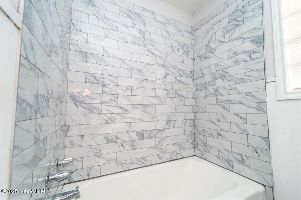 2503 30th Street Lubbock, TX 79410 - Photo 15 of 21 a bathroom with a shower