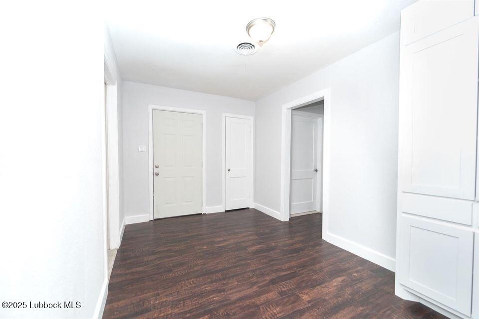 2503 30th Street Lubbock, TX 79410 - Photo 18 of 21 a view of an empty room with wooden floor