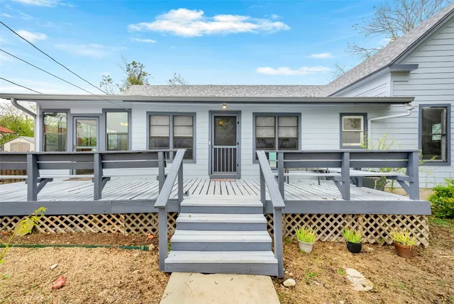 a view of a living room and kitchen with furniture