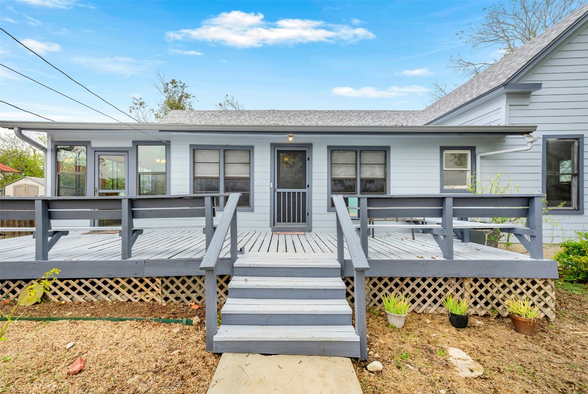 a view of a living room and kitchen with furniture