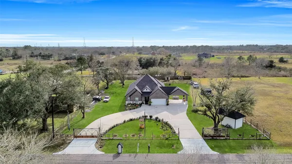 an aerial view of houses with outdoor space and city view