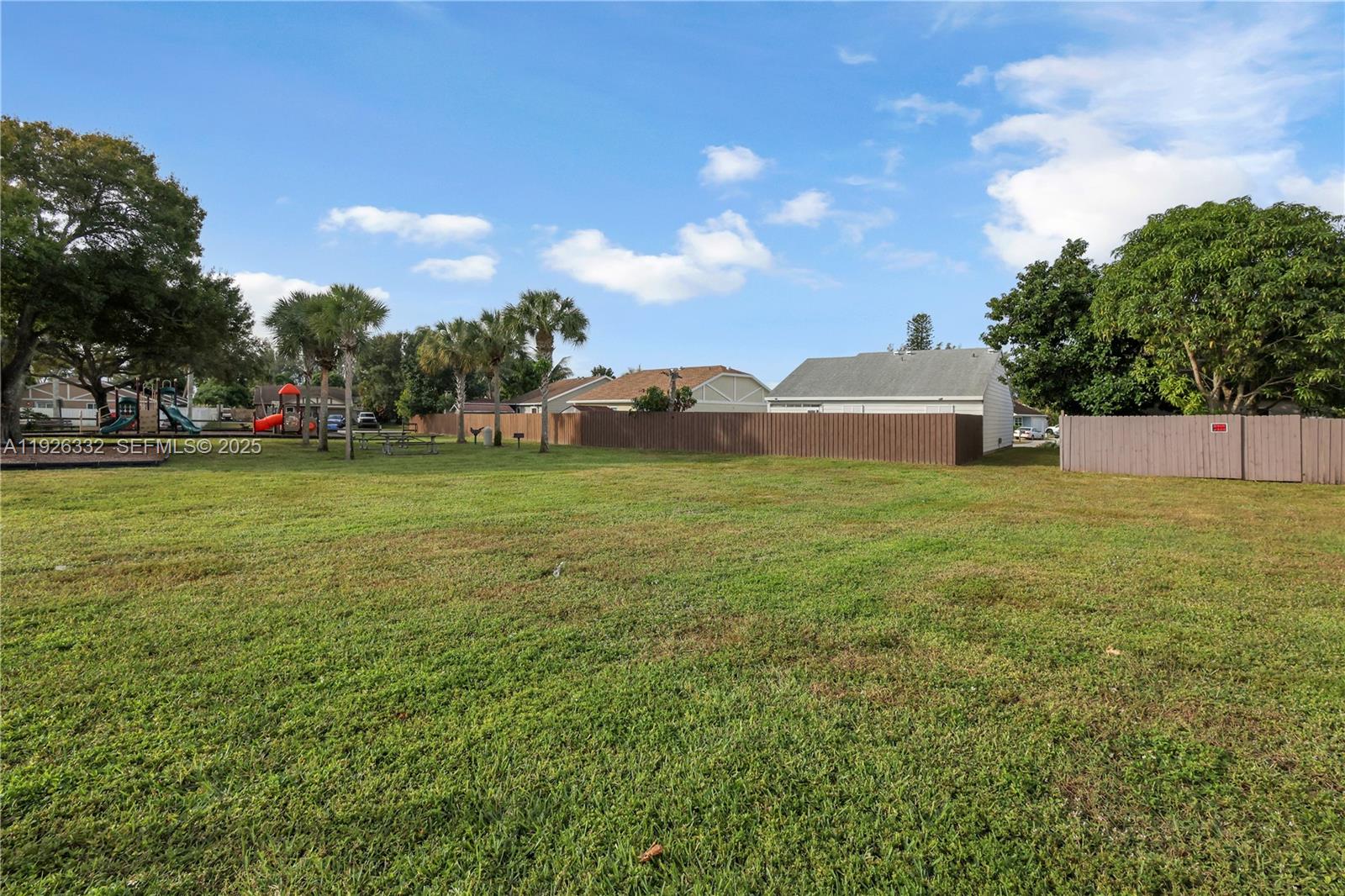 22882 Markham Way Boca Raton, FL 33428 - Photo 13 of 16 a view of a field of grass and trees