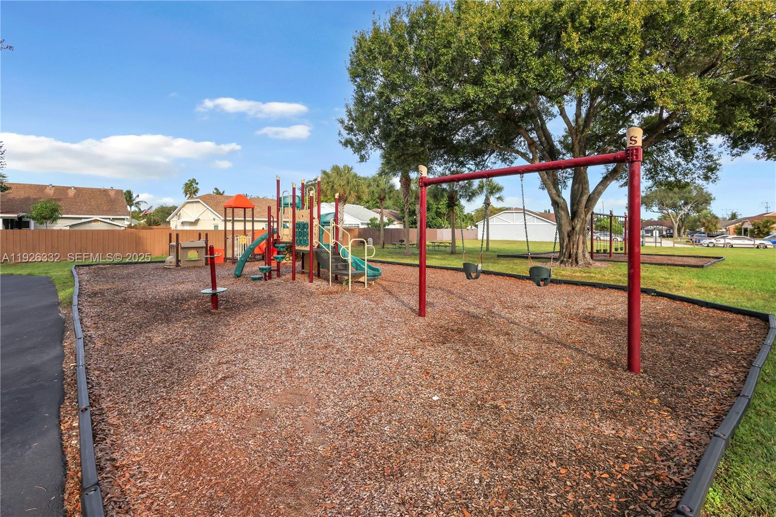 22882 Markham Way Boca Raton, FL 33428 - Photo 15 of 16 a view of park with swings