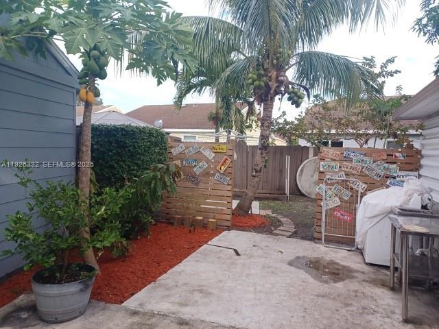 22882 Markham Way Boca Raton, FL 33428 - Photo 2 of 16 a view of a backyard with potted plants