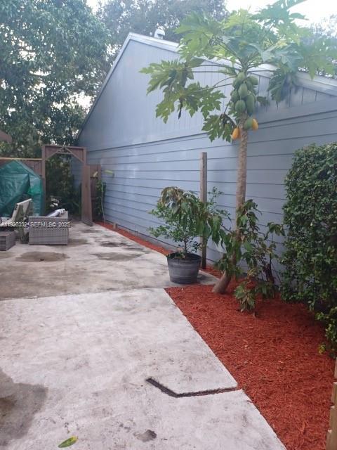 22882 Markham Way Boca Raton, FL 33428 - Photo 3 of 16 a backyard of a house with lots of green space
