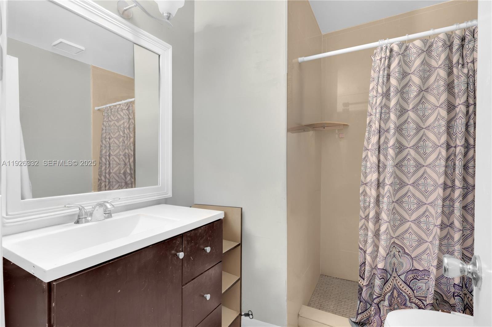 22882 Markham Way Boca Raton, FL 33428 - Photo 10 of 16 a bathroom with a sink and a mirror