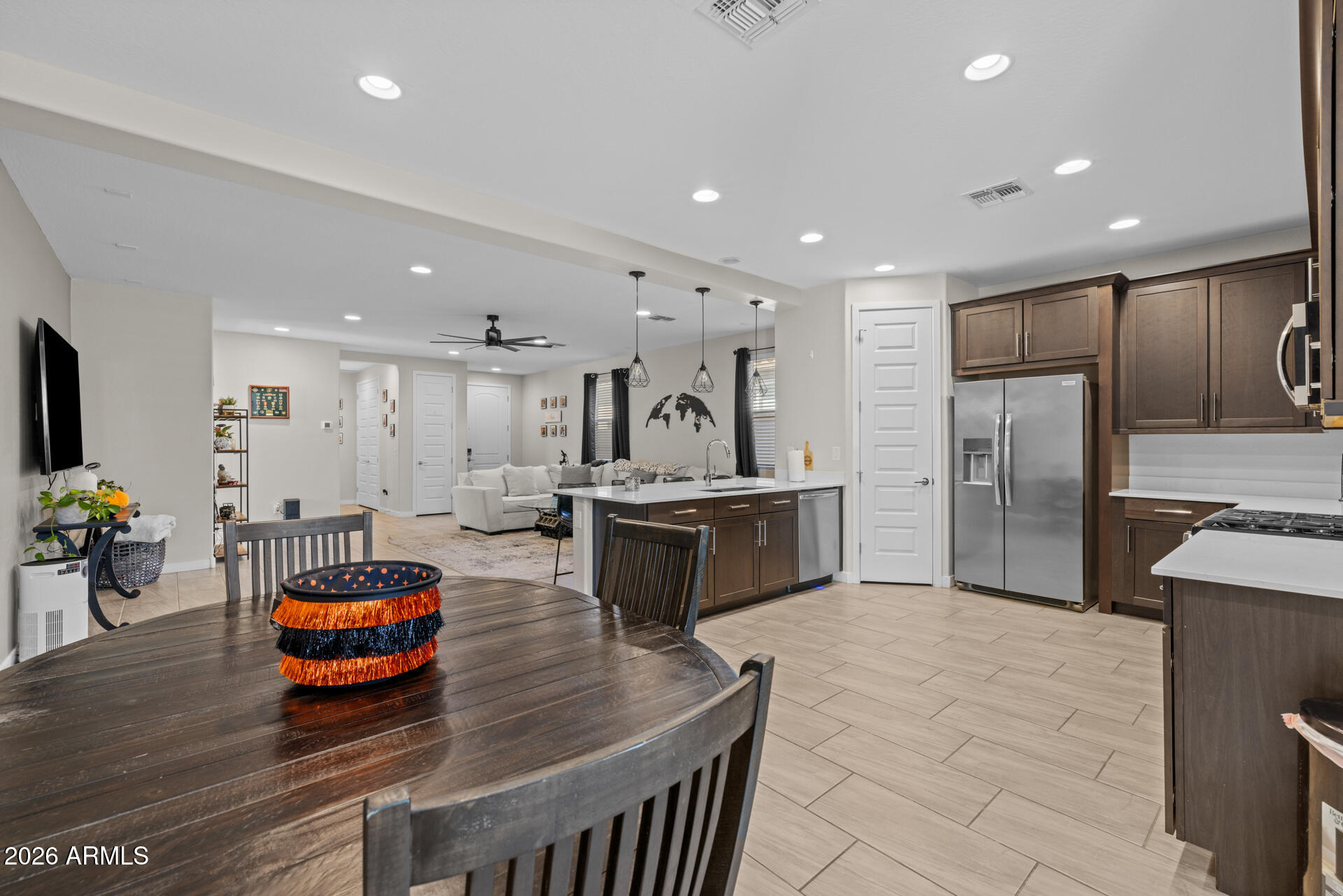4143 East Appaloosa Road Gilbert, AZ 85296 - Photo 13 of 36 a large kitchen with stainless steel appliances kitchen island granite countertop a large counter top and stainless steel appliances
