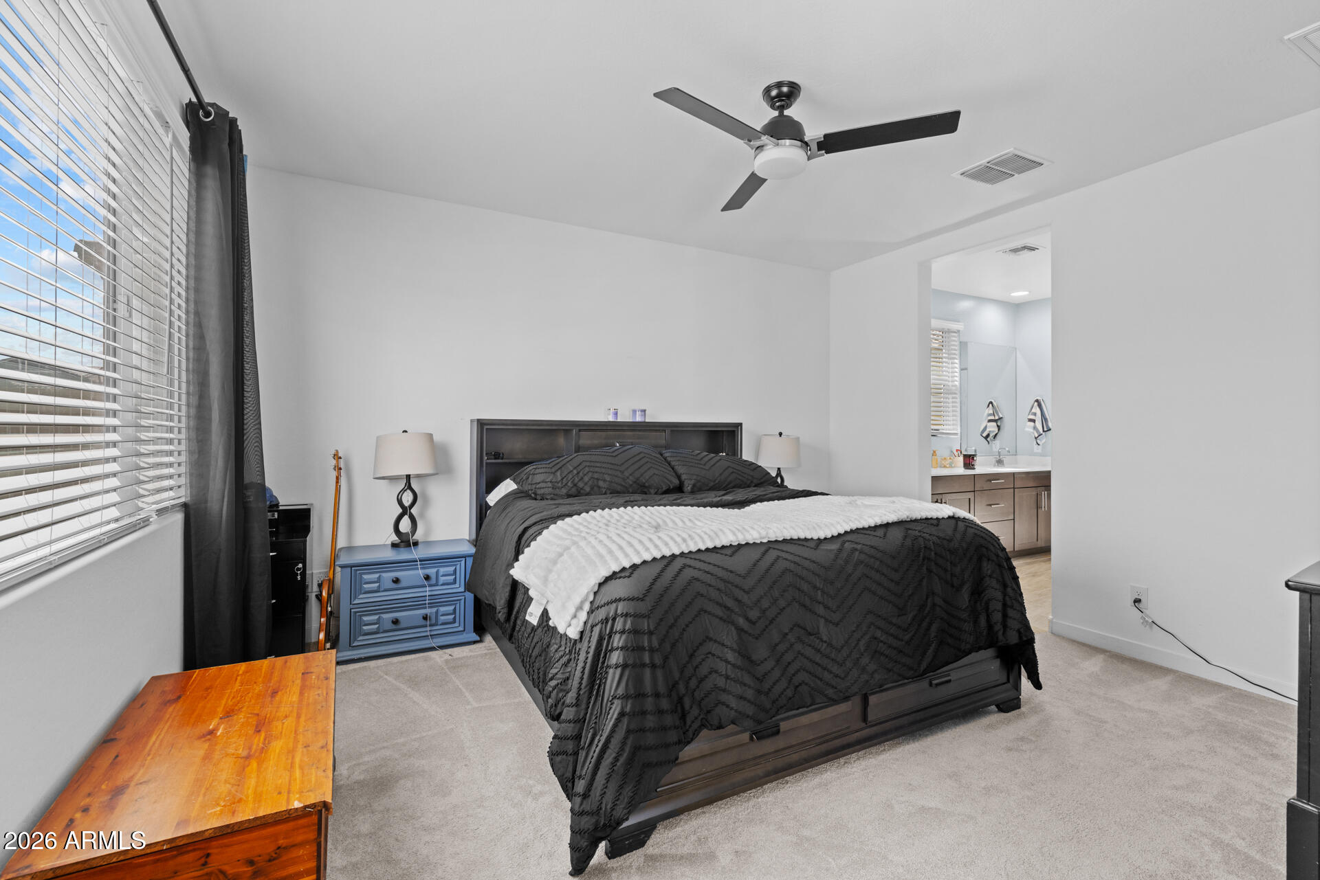 4143 East Appaloosa Road Gilbert, AZ 85296 - Photo 14 of 36 a bedroom with a bed and window