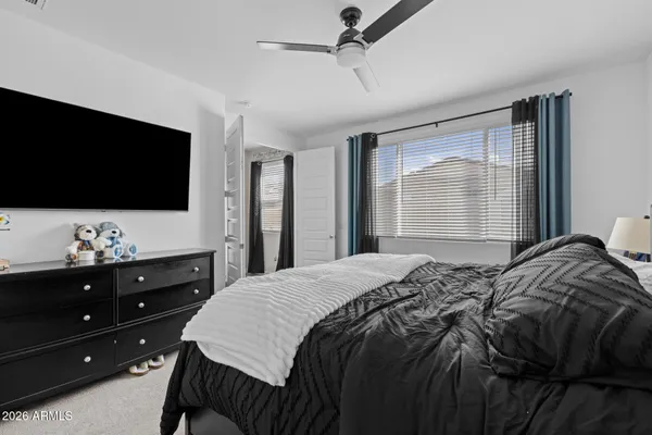 a bedroom with a bed and window