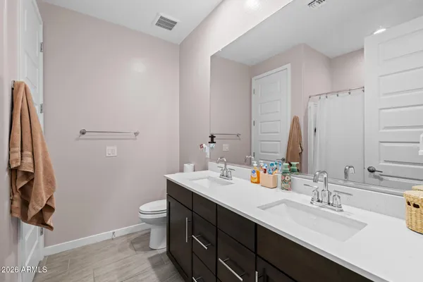 a bedroom with a bed and a tv