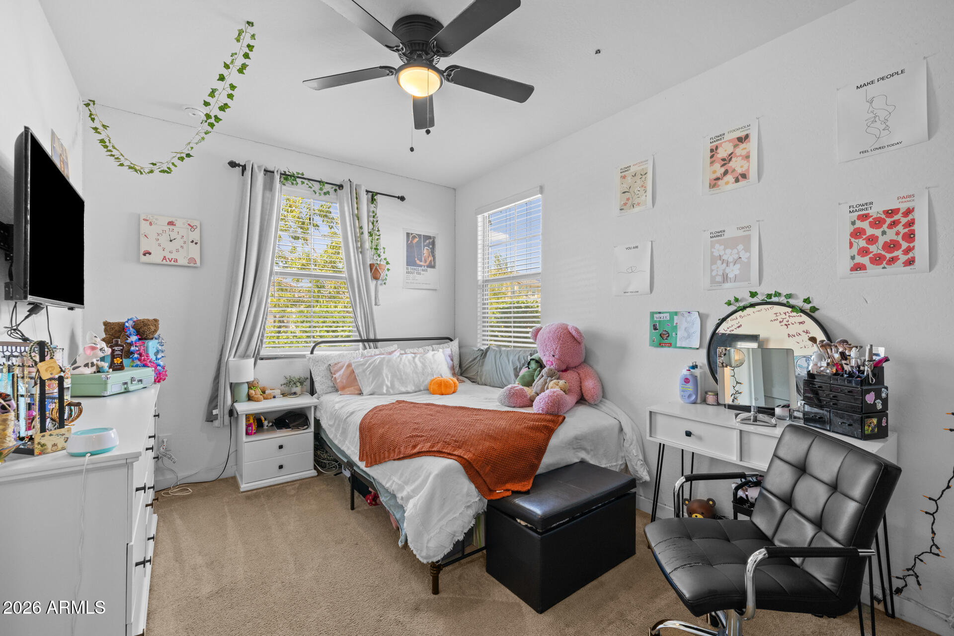 4143 East Appaloosa Road Gilbert, AZ 85296 - Photo 20 of 36 a bed room with a bed window and a flat screen tv