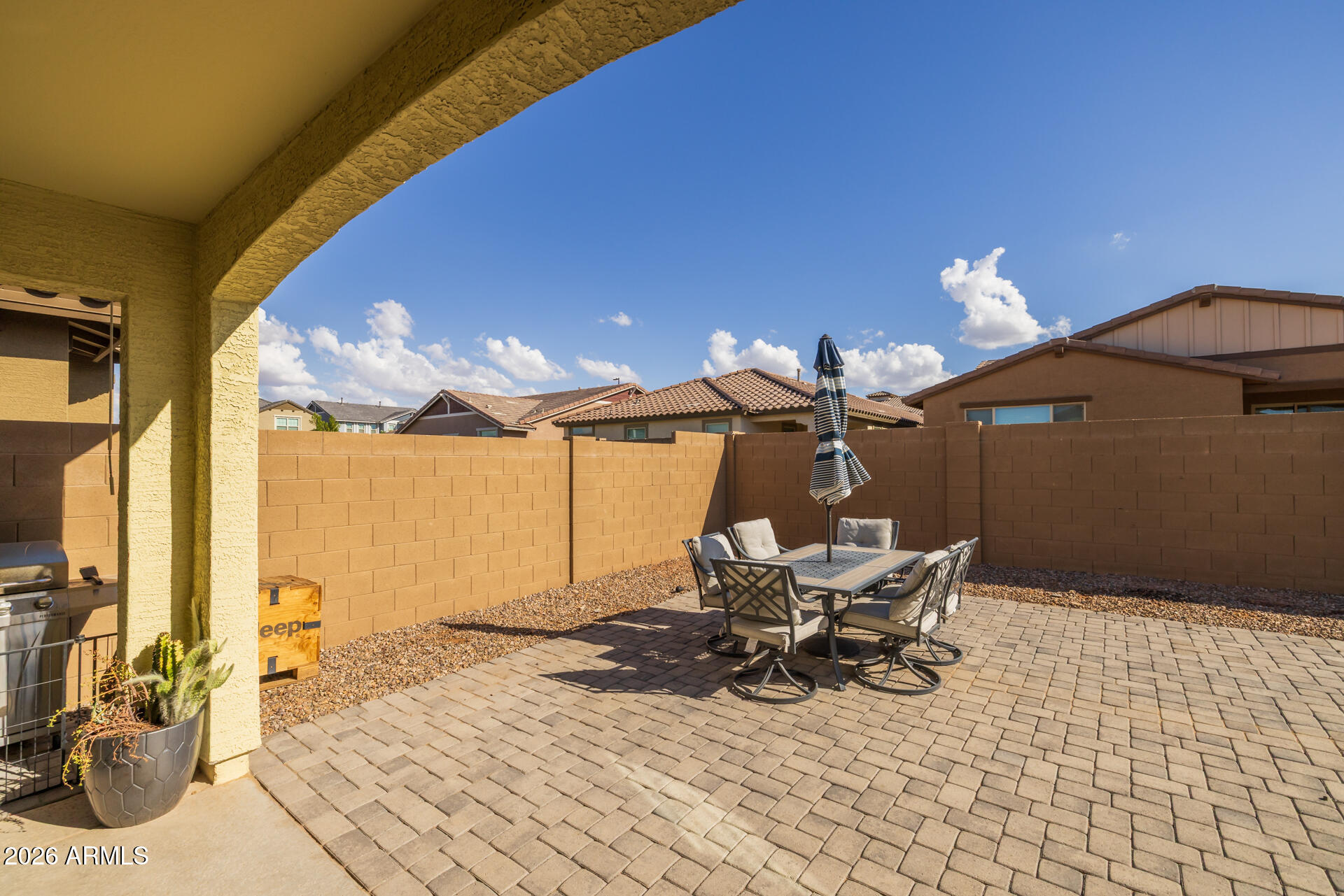 4143 East Appaloosa Road Gilbert, AZ 85296 - Photo 22 of 36 a view of a patio with table and chairs and potted plants