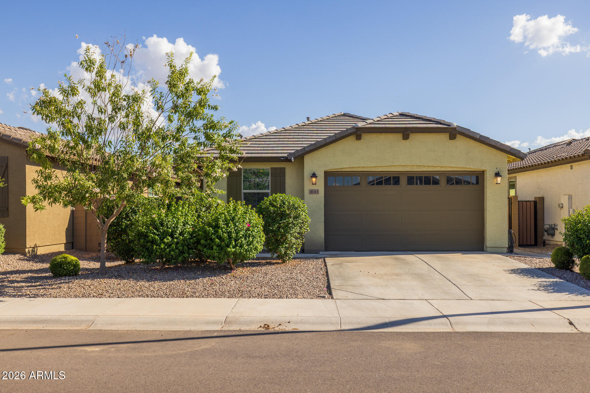 4143 East Appaloosa Road Gilbert, AZ 85296 - Photo 35 of 36 a front view of a house with a yard and garage