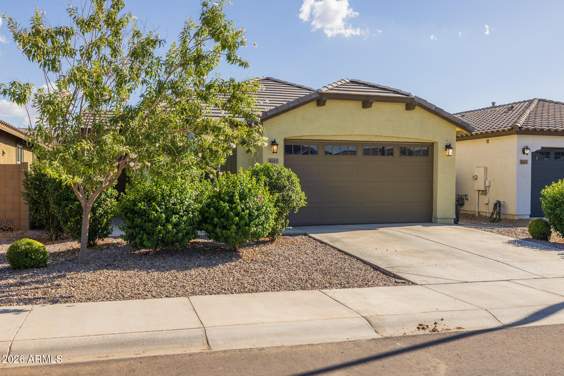 4143 East Appaloosa Road Gilbert, AZ 85296 - Photo 3 of 36 a view of a house with a plants and pathway