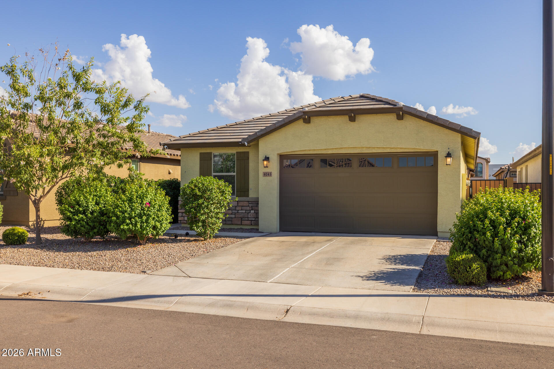4143 East Appaloosa Road Gilbert, AZ 85296 - Photo 4 of 36 a front view of a house with a garage