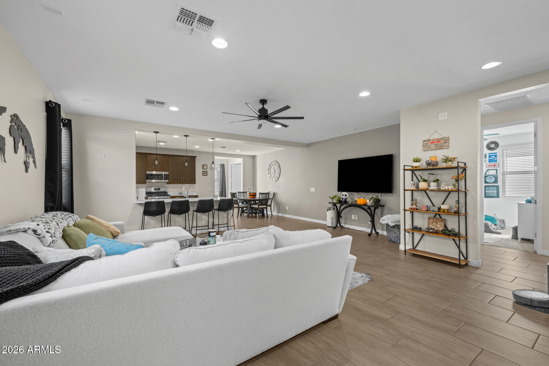 4143 East Appaloosa Road Gilbert, AZ 85296 - Photo 5 of 36 a living room with furniture and a flat screen tv