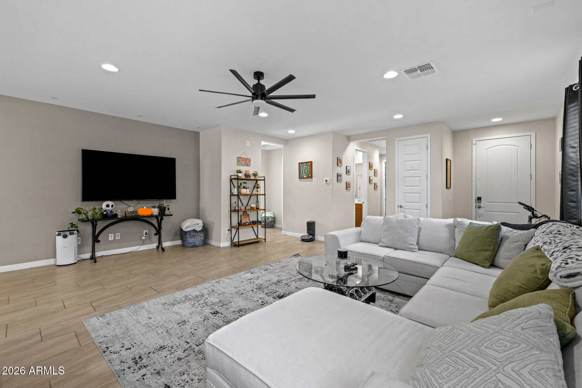 4143 East Appaloosa Road Gilbert, AZ 85296 - Photo 8 of 36 a living room with furniture and a flat screen tv