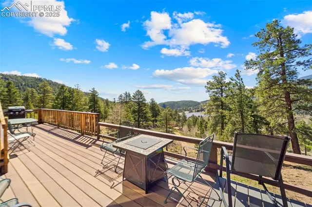 a view of a terrace with couches and wooden floor