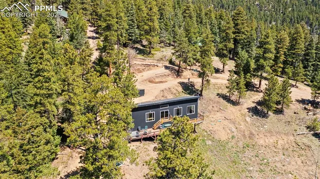a view of a house with a tree