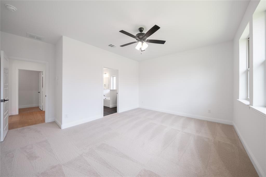 2405 St George Drive Celina, TX 75009 - Photo 9 of 30 a view of empty room with window and ceiling fan
