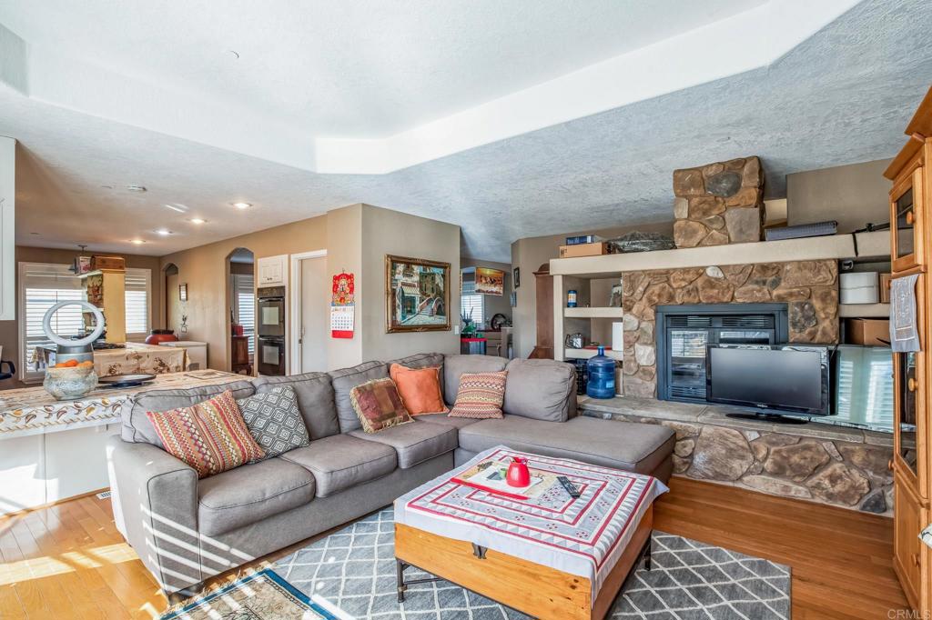 735 Swedes Flat Road Oroville, CA 95966 - Photo 13 of 37 a living room with furniture and a fireplace