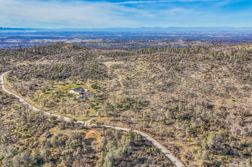 735 Swedes Flat Road Oroville, CA 95966 - Photo 32 of 37 a view of a large yard with wooden floor and a yard