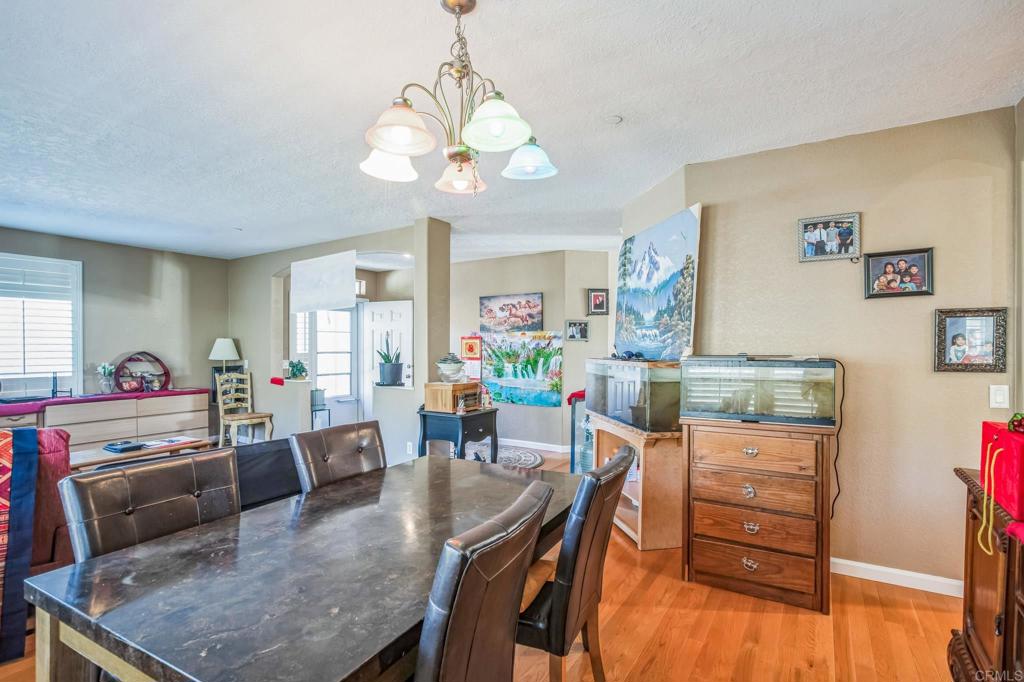 735 Swedes Flat Road Oroville, CA 95966 - Photo 10 of 37 a view of a dining room with furniture and a chandelier