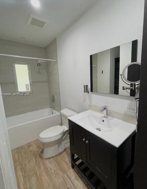 3614 Southwest 58th Avenue Miami, FL 33155 - Photo 13 of 27 a bathroom with a double vanity sink toilet mirror and bathtub