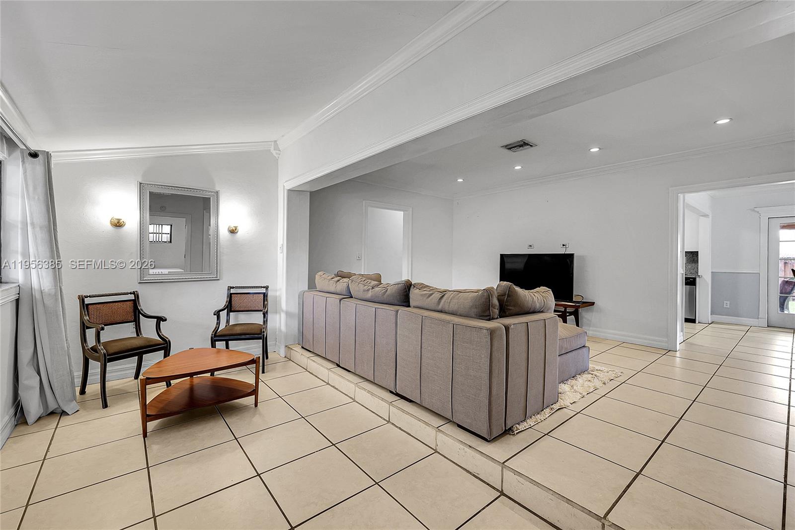 3614 Southwest 58th Avenue Miami, FL 33155 - Photo 14 of 27 a living room with furniture and a flat screen tv