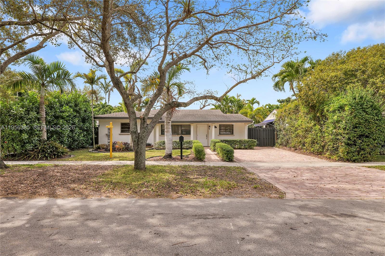 3614 Southwest 58th Avenue Miami, FL 33155 - Photo 2 of 27 a front view of a house with a yard