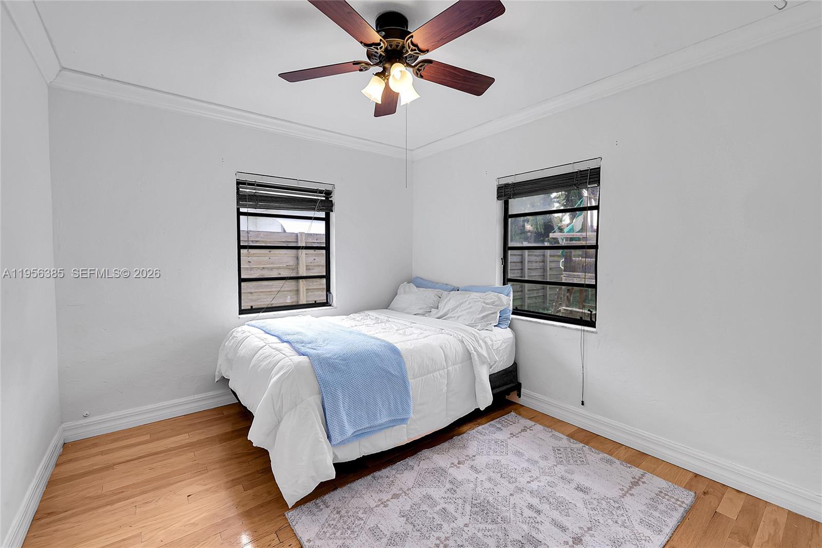 3614 Southwest 58th Avenue Miami, FL 33155 - Photo 8 of 27 a bedroom with a bed and a window