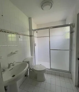 a bathroom with a tub and a shower