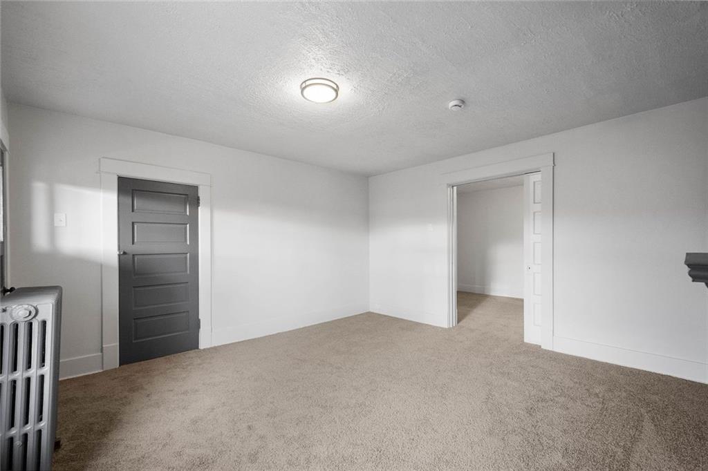 306 Park Road Ambridge, PA 15003 - Photo 14 of 43 a view of an empty room and closet area