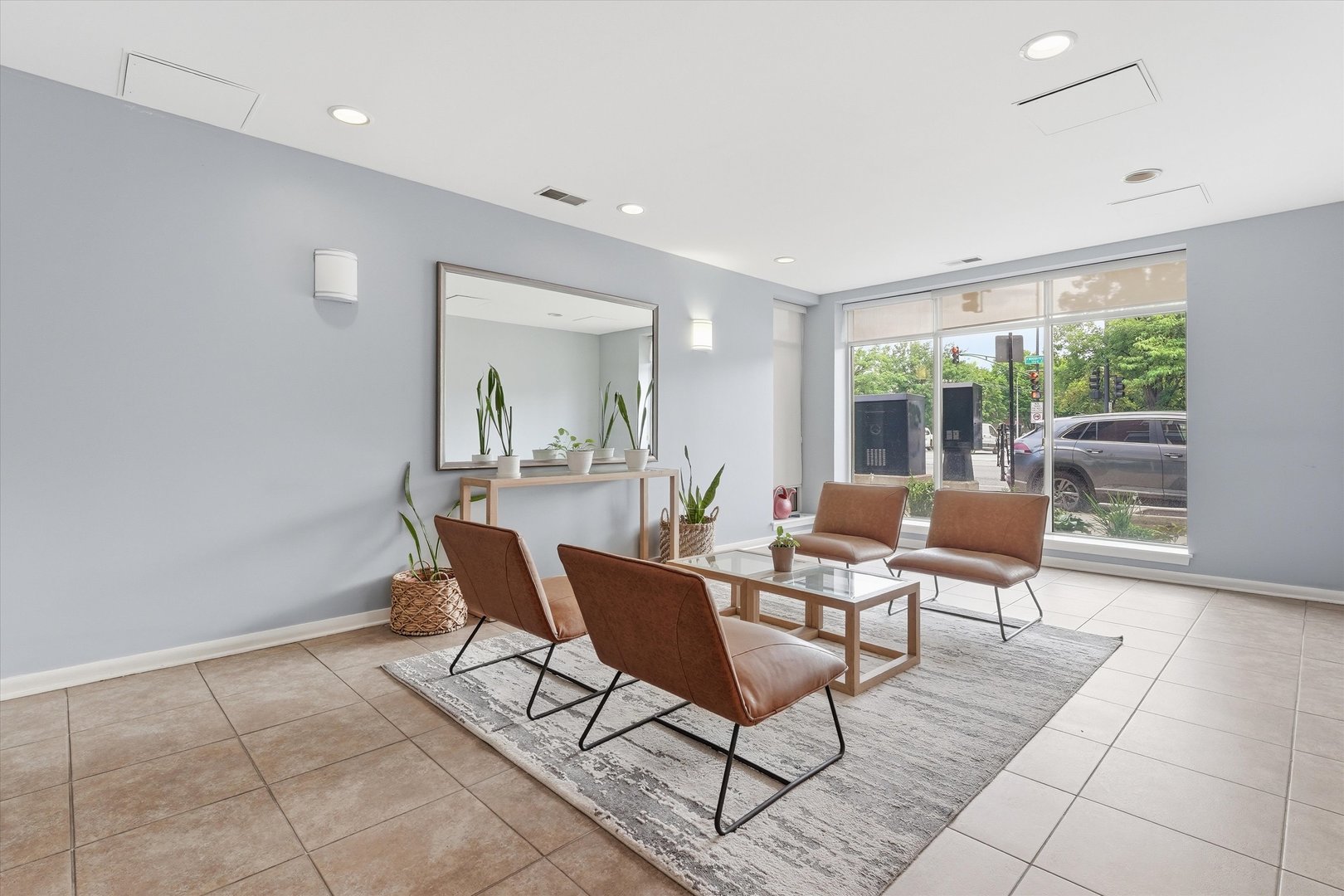 1155 West Roosevelt Road, Unit 404 Chicago, IL 60608 - Photo 3 of 30 a dining room with furniture and a floor to ceiling window