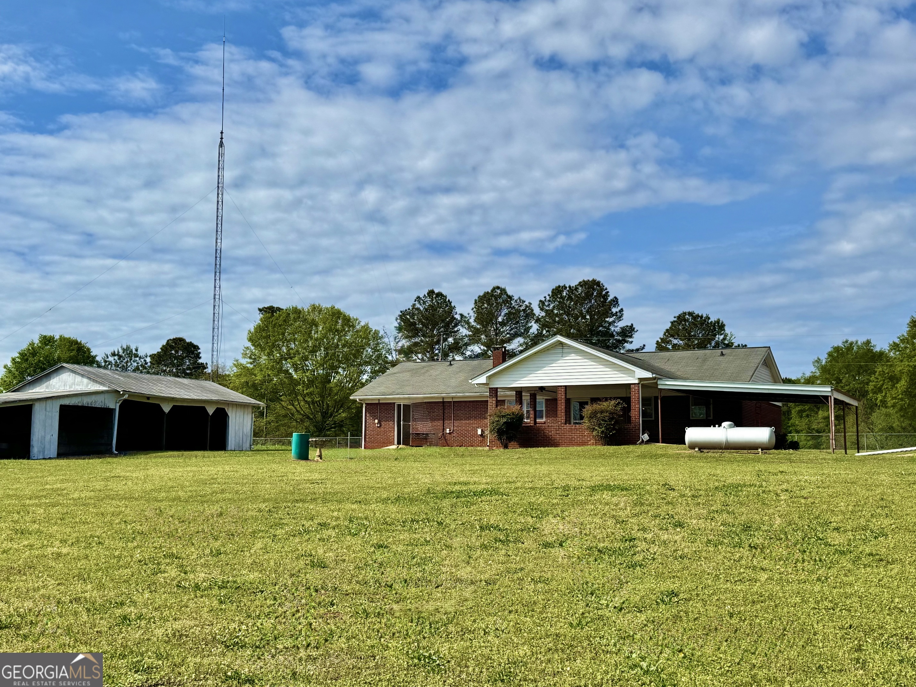 1760 Fears Road Rutledge, GA 30663 - Photo 38 of 68 a front view of a house with a yard