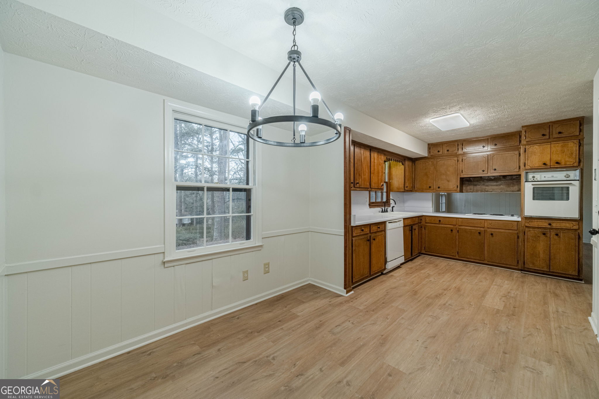 1678 Pounds Road Southwest Stone Mountain, GA 30087 - Photo 11 of 30 a kitchen with stainless steel appliances a sink and window